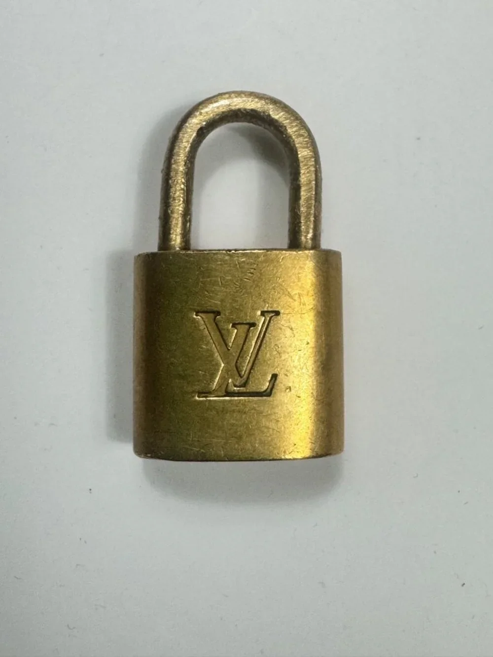 Authentic Louis Vuitton Lock No Key Gold Tone